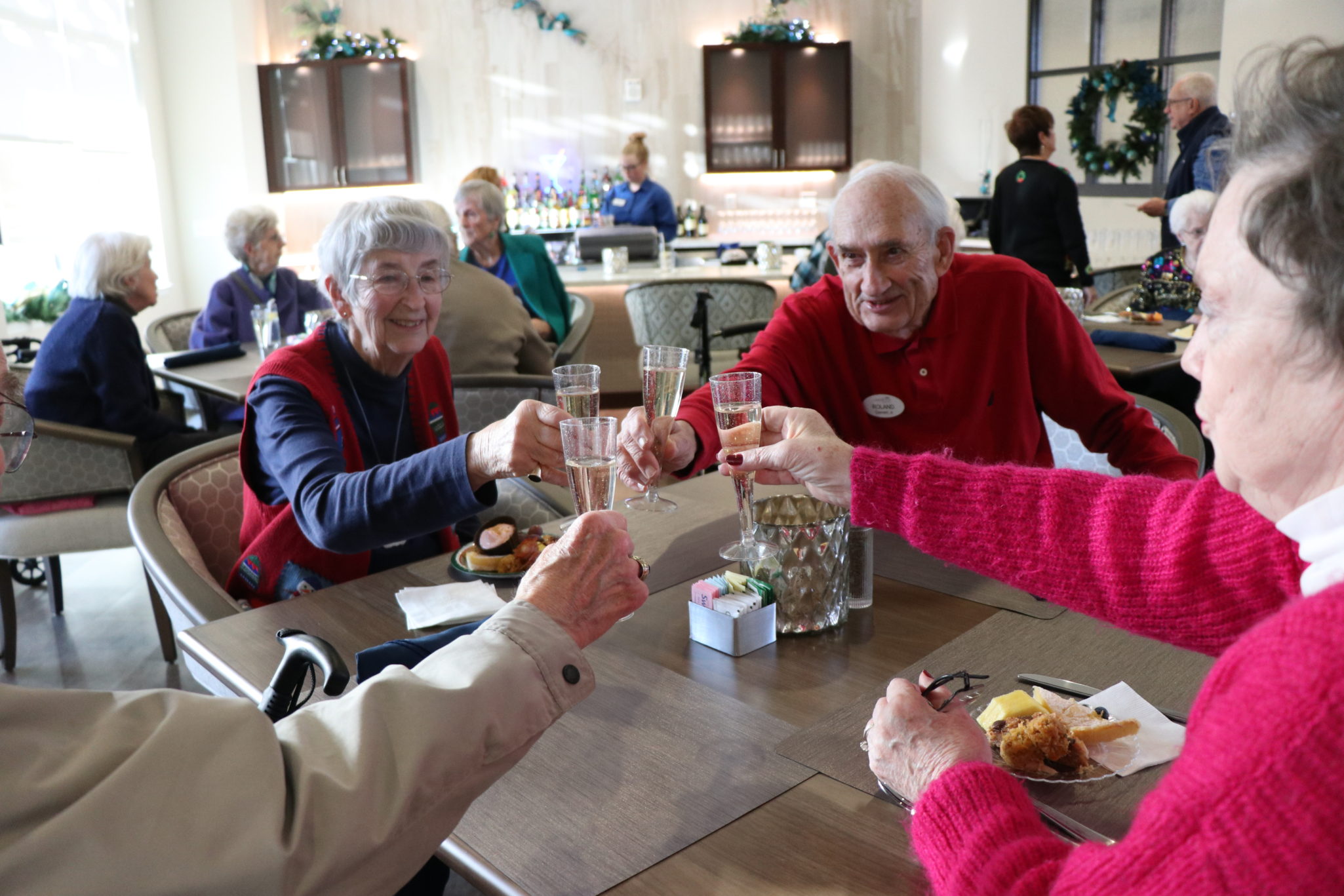 Senior couples toast at The James at Lakewood in Richmond, VA.
