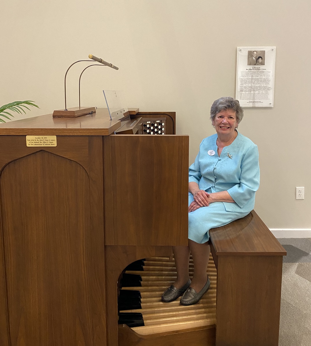 Spiritual Music Event with Senior Woman sitting at the Organ